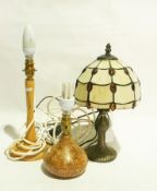 A collection of polished wood lamps,