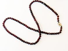 String of faceted garnet beads