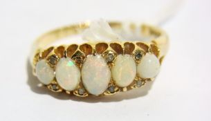 Gold, opal and diamond ring set five gra