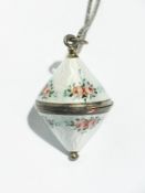 Continental silver and enamel locket style pendant, rounded double-cone shaped, white enamel ground,