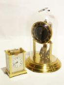 A brass anniversary clock under glass dome and a Shortland Bowen brass commemorative carriage clock