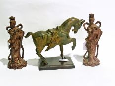 A Chinese Tang style metal horse with two oriental ladies