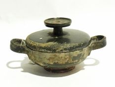 Ancient Greek black glazed pot and cover,