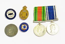 A collection of medals including defence medal