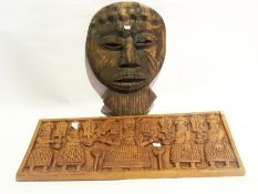 A wooden African mask, a small African m