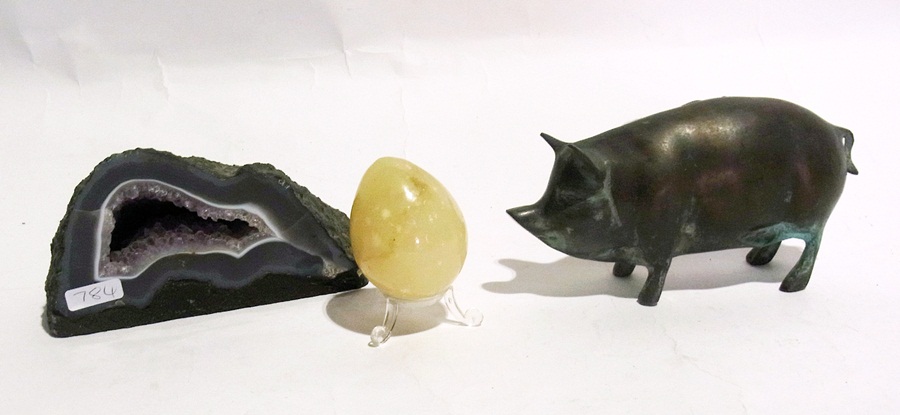 An agate stone with pigs and fish and four stone eggs