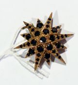 Gold and sapphire starburst brooch, the