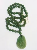 Carved and pierced jade floral pendant o