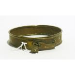 A brass antique dog collar