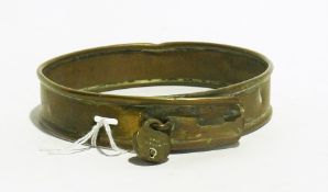 A brass antique dog collar