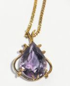 Gold-coloured metal and amethyst pendant