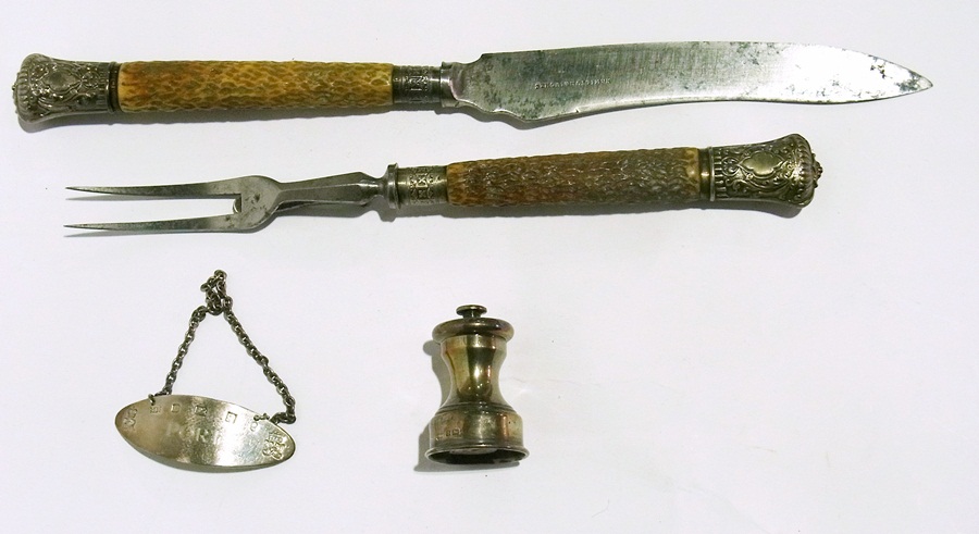 A horn handled carving set with engraved