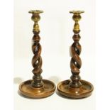 Two wooden turned candlesticks with bras