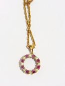 18ct ruby and diamond circle pendant on 9ct chain