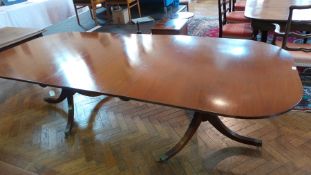 George III style mahogany D-end extending double pedestal dining table on reeded swept supports