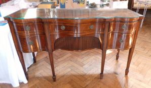 George III mahogany wavy front sideboard with frieze drawer above tambour-fronted shelf,