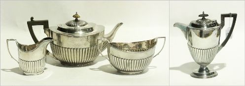 Georgian style Edwardian matched silver four-piece tea service, semi-gadrooned and oval,