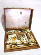 A wooden box with artist's oils, artist'