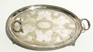 A large silver plate oval tray with bead