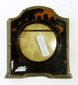 Early 20th century silver and tortoiseshell photograph frame of shaped form,
