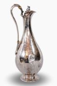 A Victorian silver claret jug of elegant