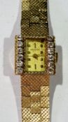 Lady's Bulova gold and diamond set wrist