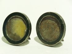 Two silver circular photograph frames