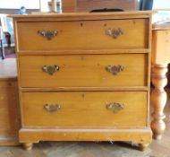 A pine chest of two long and two short drawers, a stained oak decanter holder, a pine blanket box,
