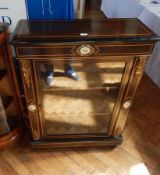 A pair of early 19th century ebonised side cabinets with boxwood stringing,