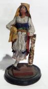 Pair of Spanish style papier mache figures of a man and woman in traditional dress.