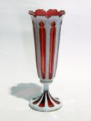 Victorian white opaline and cranberry overlay vase having shaped serpentine everted rim,