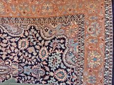 Eastern silk rug, blue ground, central floral field with pale pink border,