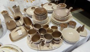 An extensive Poole pottery two-tone dinner service in beige and brown,