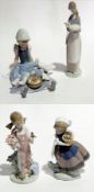 Lladro figure of girl seated feeding duck and ducklings in her lap, another shepherdess,