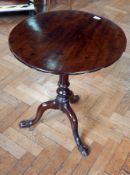 A Georgian mahogany circular top tripod table with birdcage movement,