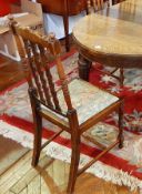 A set of six carved oak dining chairs with splat back,