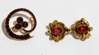 Gold-coloured metal and garnet shamrock brooch and yellow metal and pink stone set scroll brooch