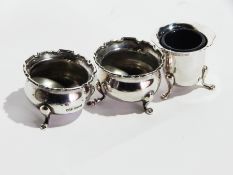 A pair of silver open salts raised on pad feet and a silver plate salt pot (3)