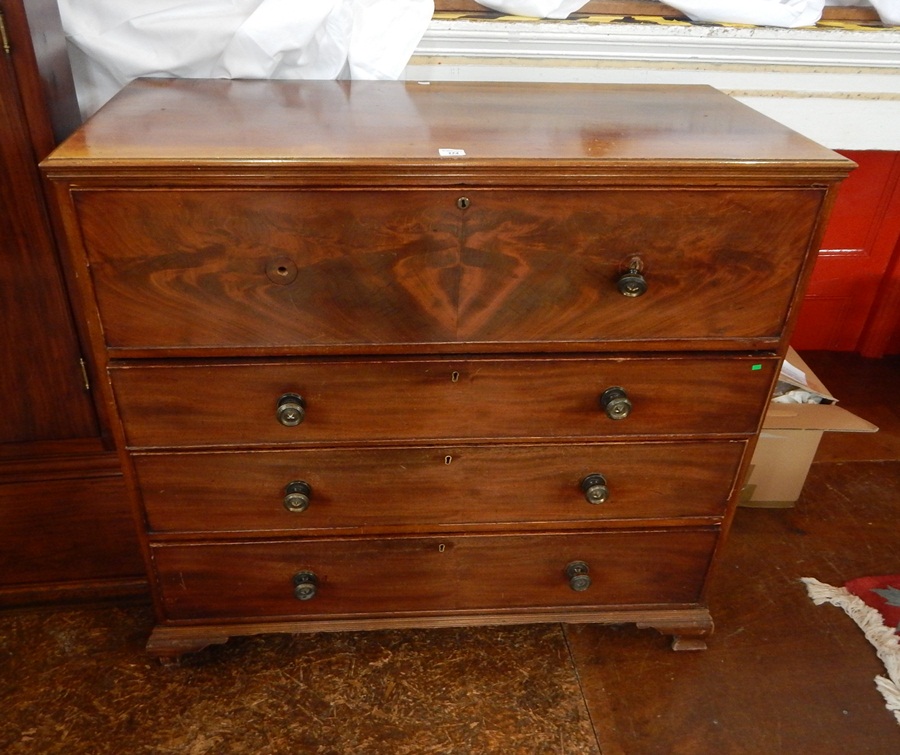 A 19th century mahogany secretaire chest, the drawer fitted with pigeonholes and small drawers,