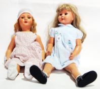 Two mid 20th century large composition girl dolls in cotton dresses (2)