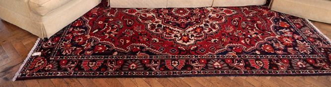 Persian style wool rug with central medallion,