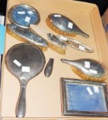 A silver backed hand mirror, two hairbrushes (af),