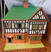 1930's Triang type doll's house, mock Tudor with leaded windows,