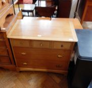 Stag furniture, pale wood chest of three short drawers and two long drawers on bracket feet,