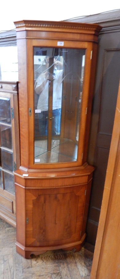 Modern yew wood floor-standing corner cabinet with glazed and mirrored upper section