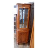 Modern yew wood floor-standing corner cabinet with glazed and mirrored upper section