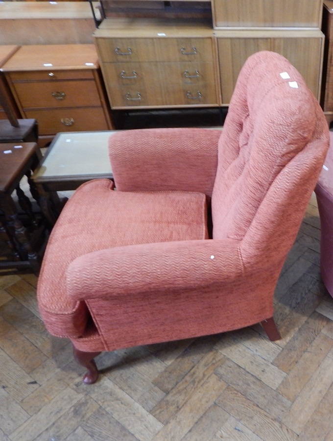 Early 20th century tub chair on square section supports and castors,