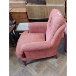 Early 20th century tub chair on square section supports and castors,