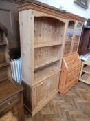 A pine open-fronted bookcase