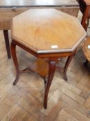 An Edwardian walnut octagonal top occasional table with square cabriole legs united by cross